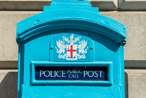 London, United Kingdom - June 25, 2016: London police public call box. Original police blue telephone box which was free for use of public, no longer operational.