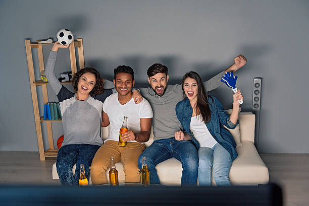 istock Group of friends watching sport together 578836468
