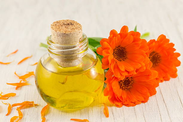 istock marigold oil with a fresh flower bouquet 578836524
