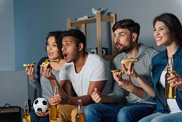 Photo of Group of friends watching sport together