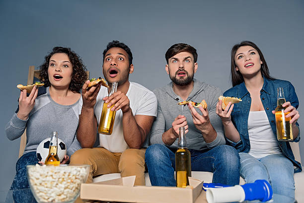 istock Group of friends watching sport together 578836588