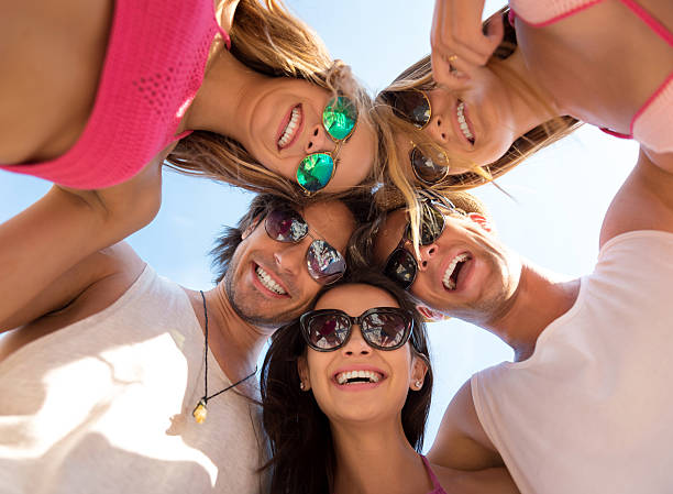 istock Cheerful delighted friends having fun on the beach 578837018