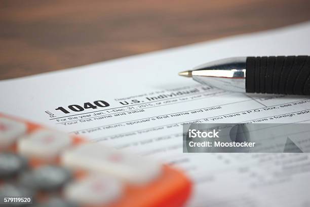 Us Tax Form 1040 Stock Photo - Download Image Now - IRS Headquarters Building, Tax, Calculator