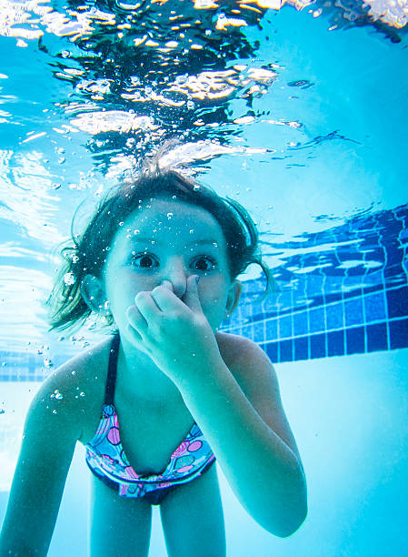istock Little Girl Swimming 579120804