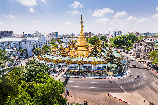 Sule Pagoda on a fine day Sule Pagoda during the day from above in downtown Yangon, Myanmar on a clear day yangon photos stock pictures, royalty-free photos & images