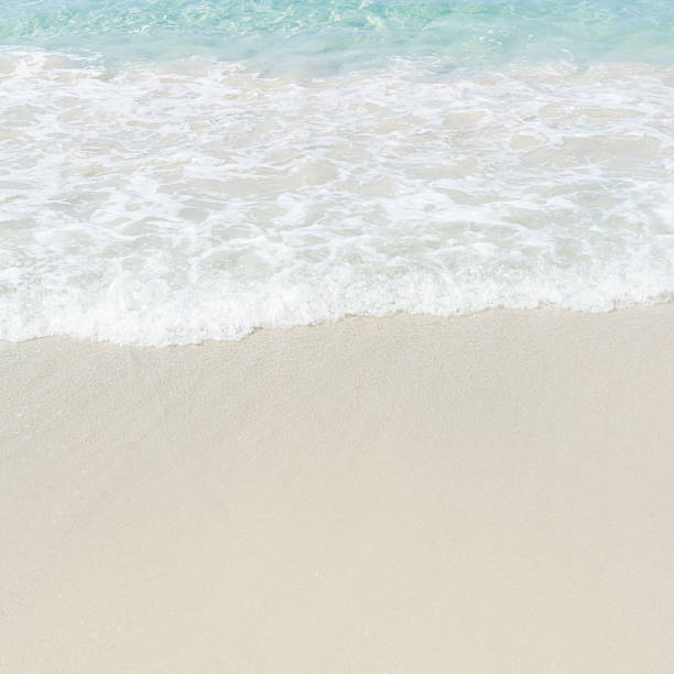 istock Motion blur sea wave on sand beach. 579122630