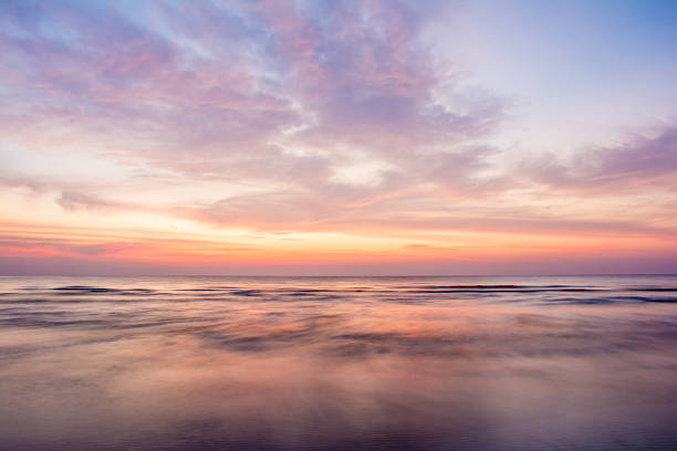istock Sea wave under twilight sunset sky  with motion blur. 579123532