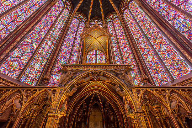 The interior of the Sainte Chappelle in Paris, France.  These stunning stained glass windows are from the interior of the upper floor chapel.