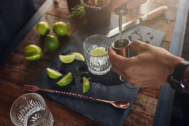 istock Pouring alcohol in jigger to prepare a cocktail 579128024