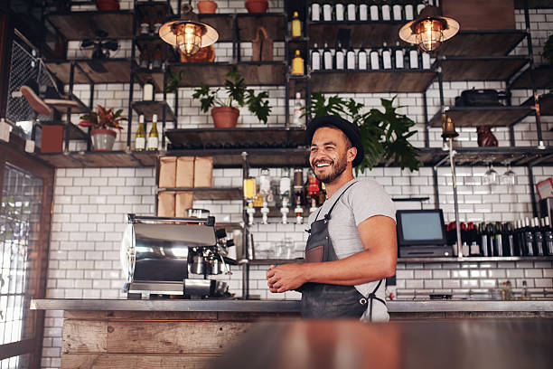 istock Happy young bar owner standing at the counter 579128186