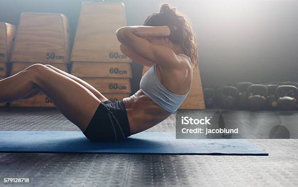 Fitness Woman Doing Abs Crunches Stock Photo - Download Image Now - Sit-ups, Abdominal Muscle, Exercising