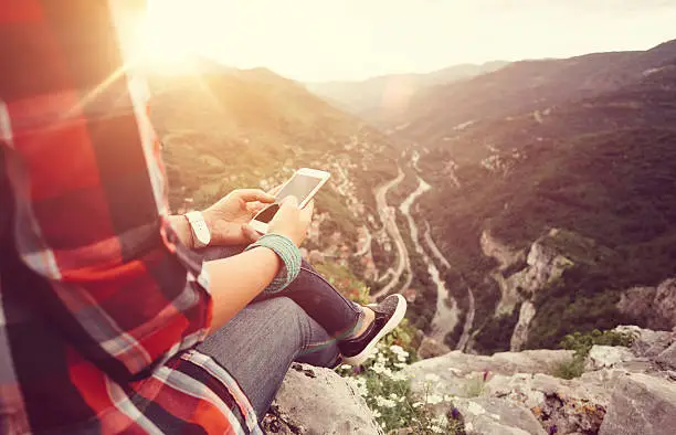 Photo of Texting on the mountain top