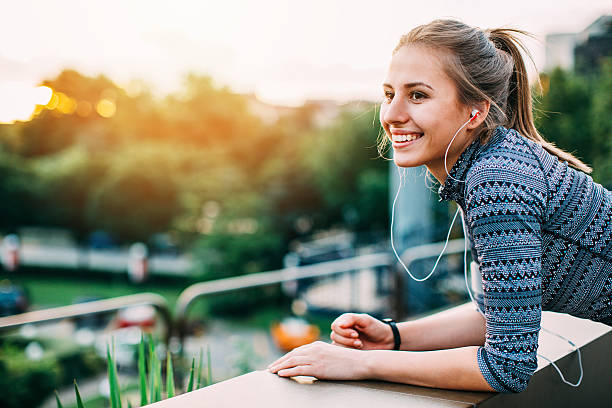 Smiling athlete resting in green area