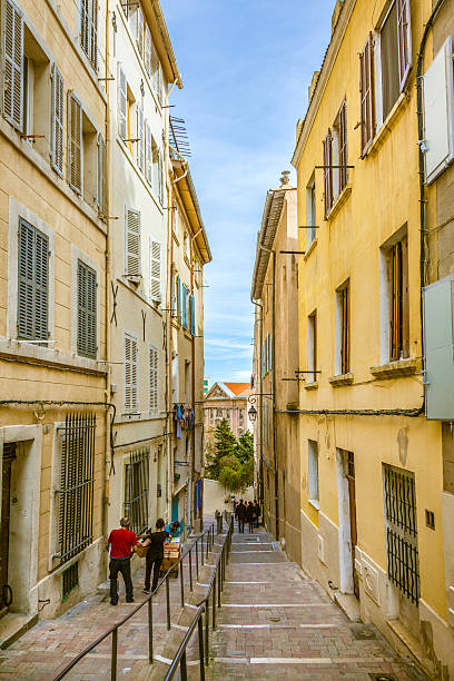 people visit the historic quarter Le Panierin Marseille Marseilles, France - March 29, 2015: people visit the historic quarter Le Panierin Marseille in South France marseille panier stock pictures, royalty-free photos & images