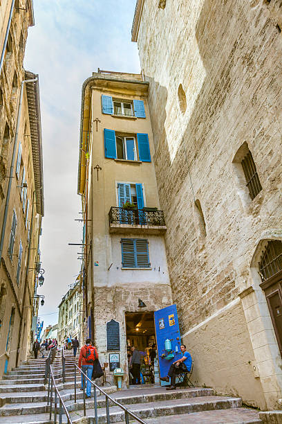 people visit the historic quarter Le Panierin Marseille Marseilles, France - March 29, 2015: people visit the historic quarter Le Panierin Marseille in South France marseille panier stock pictures, royalty-free photos & images