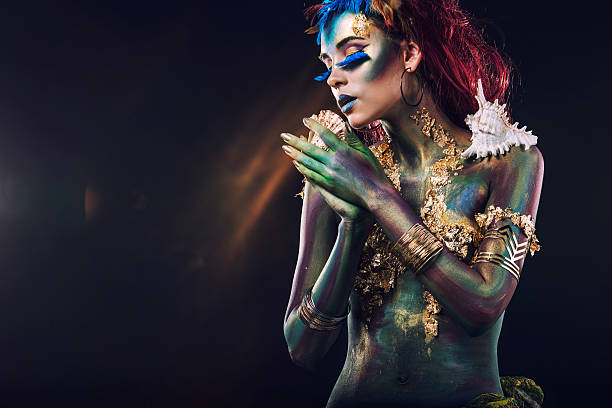 Beautiful young girl with body art in an  fantasy style Beautiful young girl with body art in an unusual fantasy style body paint photos stock pictures, royalty-free photos & images