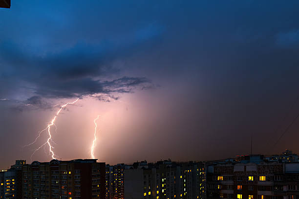 istock Storm clouds, heavy rain. Thunderstorm and lightning over the city. 579135960
