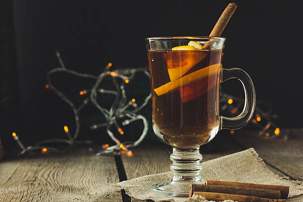 istock Mulled wine in glass and cinnamon pipes 579138376