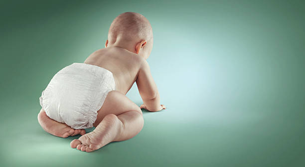 istock Baby. Newborn in the diapers. Isolated. Back view 579140306