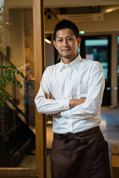 istock Small business cafe owner greeting customers 579140436