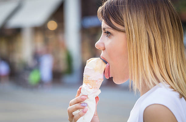 istock woman eating an ice cream in summer 579140574