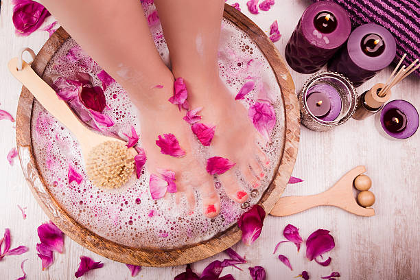 Foot massage in a spa salon Foot massage in a spa salon home pedicure stock pictures, royalty-free photos & images