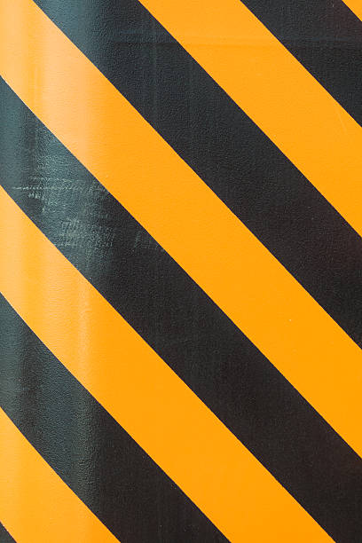 istock black and yellow strip line background 579141076