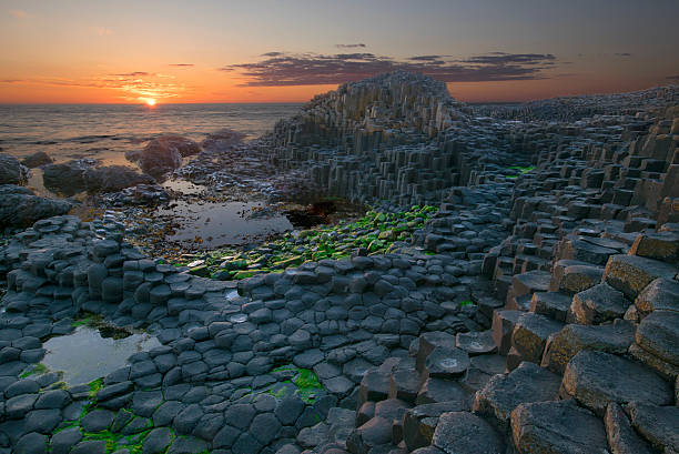 Sunset at Giant Causeway Sunset at Giant Causeway - Northen Ireland giants causeway photos stock pictures, royalty-free photos & images