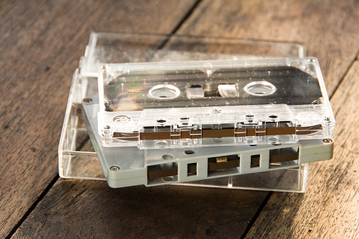 Audio cassette - wooden background