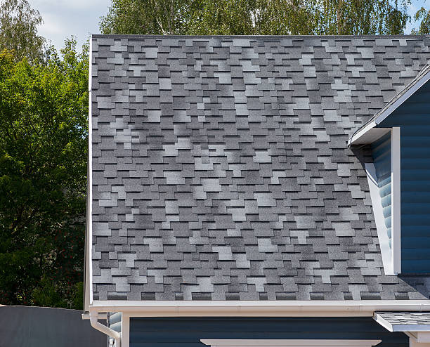 The roof with bitumen shingles stock photo