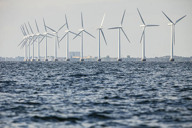 istock wind turbines power generator farm along coast sea 579148050