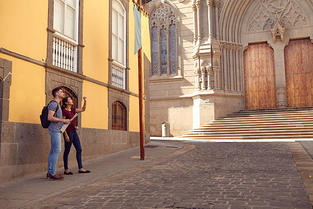 istock Young tourist couple on a vacation looking up 579149154