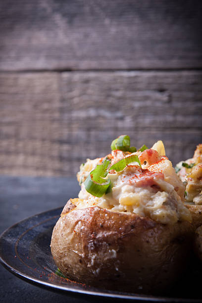 istock Baked stuffed potatoes with bacon, eggs and chives 579149478