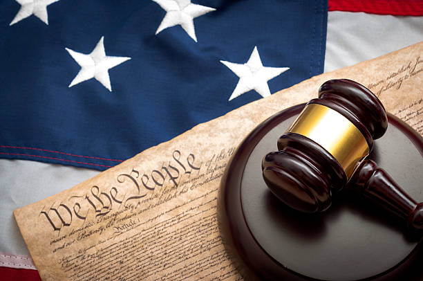 The federal judiciary of the United States American flag, US constitution and a judge's gavel symbolizing the American justice system or the Judicial Branch of government ( Judiciary ) criminal stock pictures, royalty-free photos & images