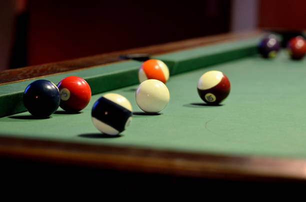 istock Pool table with pool balls and cue ball 579153698
