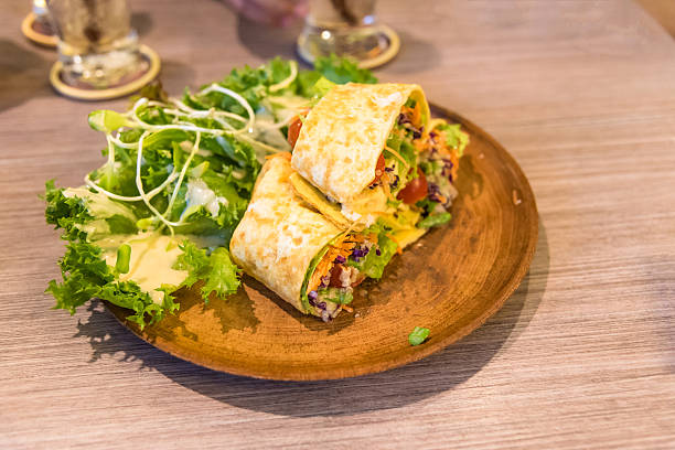 istock fresh tortilla wraps with vegetables on the plate 579154786