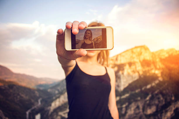 istock Beautiful girl taking a selfie 579156834