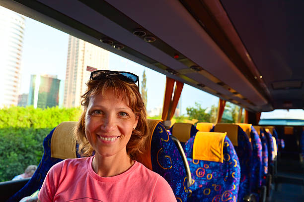 istock Happy woman on the bus 579157036