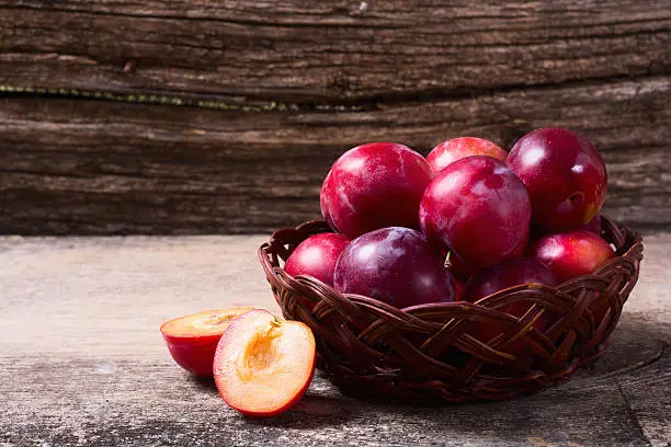 Photo of plums in basket