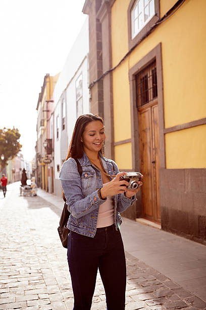 istock Pretty young girl looking at her camera 579158214