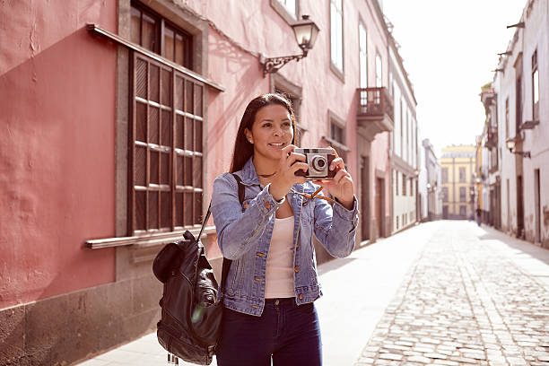 istock Pretty young girl looking up with a camera 579158284