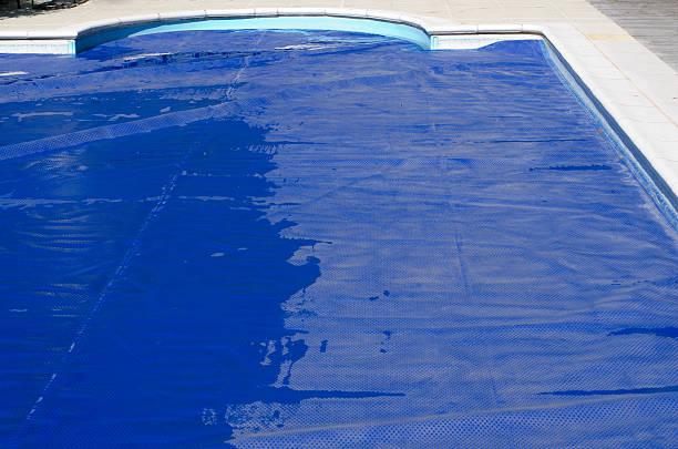 istock Swimming pool cover on a domestic swimming pool 579160190