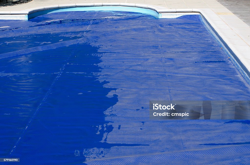 Swimming pool cover on a domestic swimming pool Swimming Pool Stock Photo