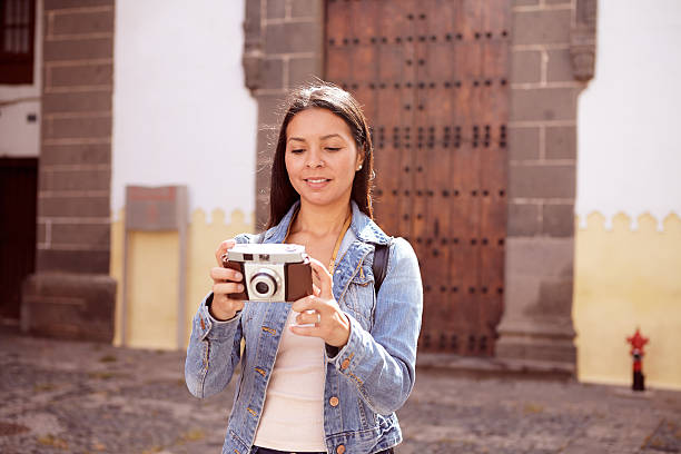 istock Serious young girl taking a picture 579160544