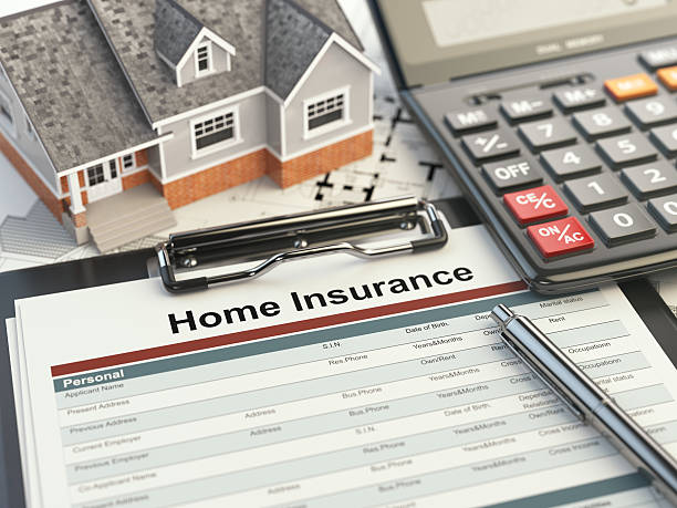 istock Home insurance form, house, calculator and binders, 579160668