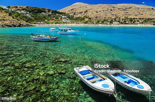 View Of The Coast With Boats In Lindos Bay Greece Stock Photo - Download Image Now - Lindos, Above, Aegean Sea