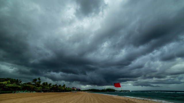 Storm clouds fast pass over Nusa Dua Beach. FullHD Timelapse - Bali, Indonesia