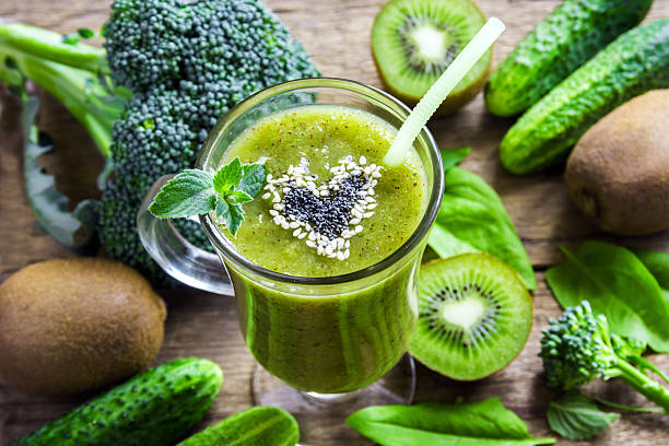 Green vegetable smoothie Green vegetable and herbs smoothie with heart of poppy and sesame seeds. Love for a healthy raw food concept. celery heart stock pictures, royalty-free photos & images