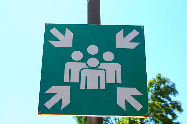 istock Green assembly point sign on street 579218772