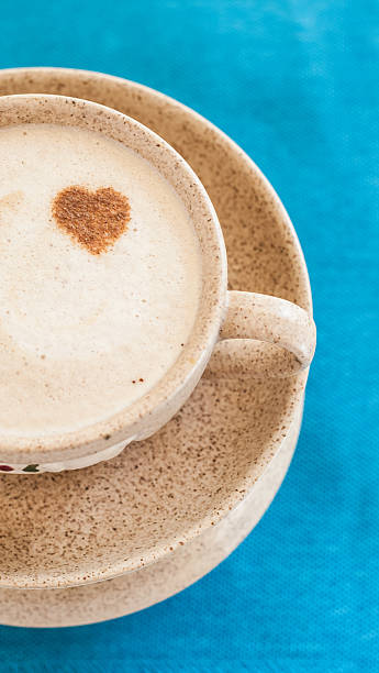 istock Cup and saucer and heart on a blue background 579221740